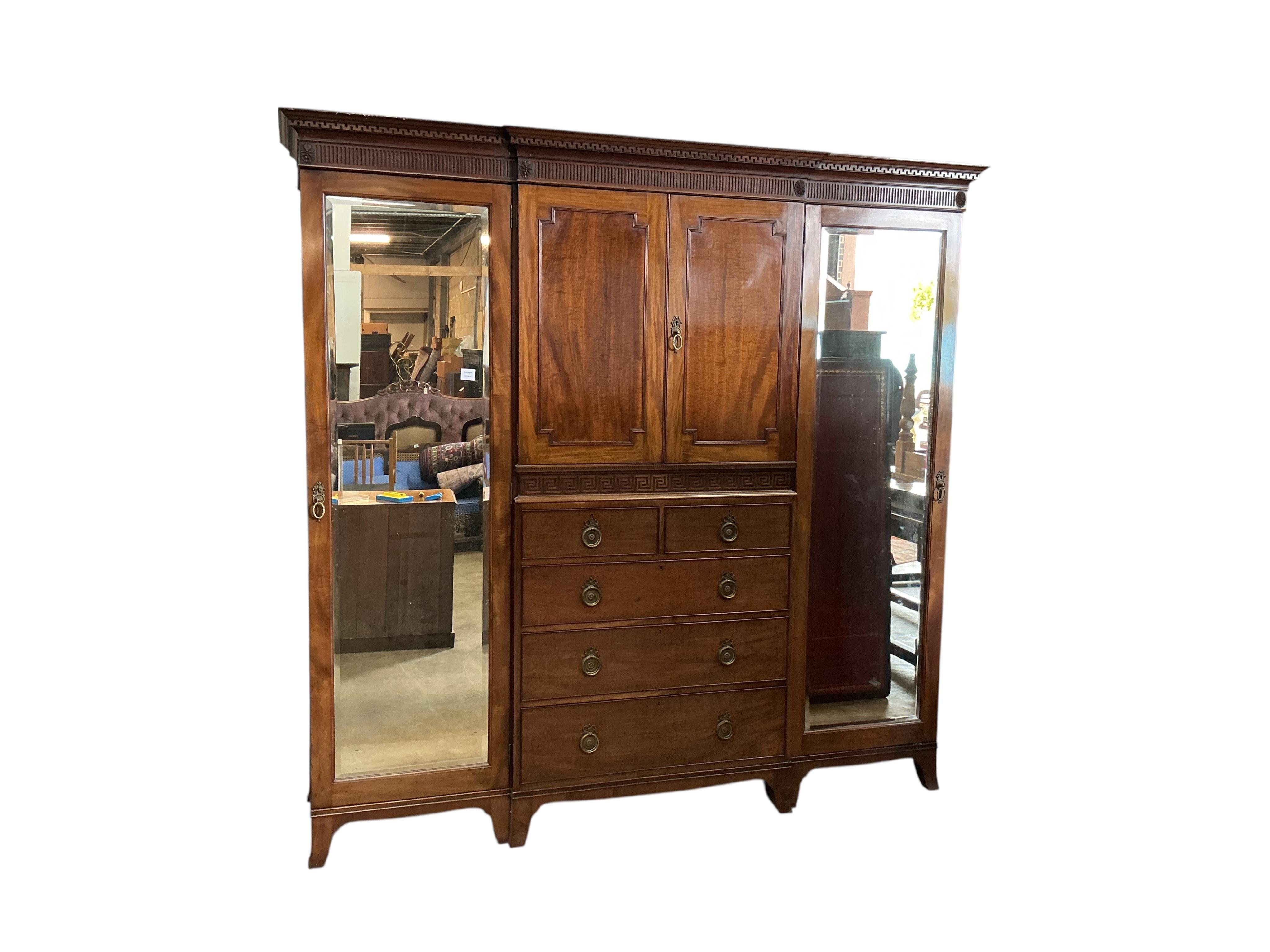 An early 20th century Heal & Son mahogany mirrored compactum wardrobe, width 224cm, depth 58cm, height 215cm